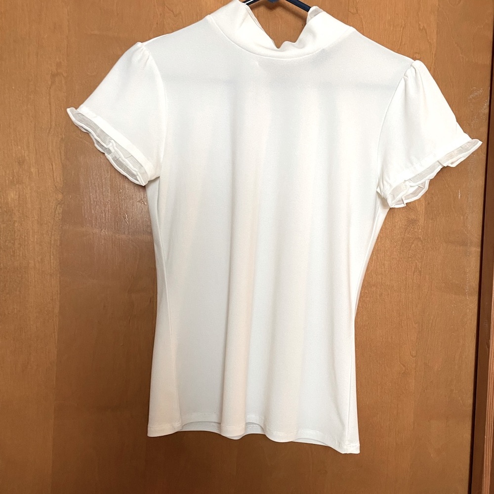 White mock turtleneck blouse